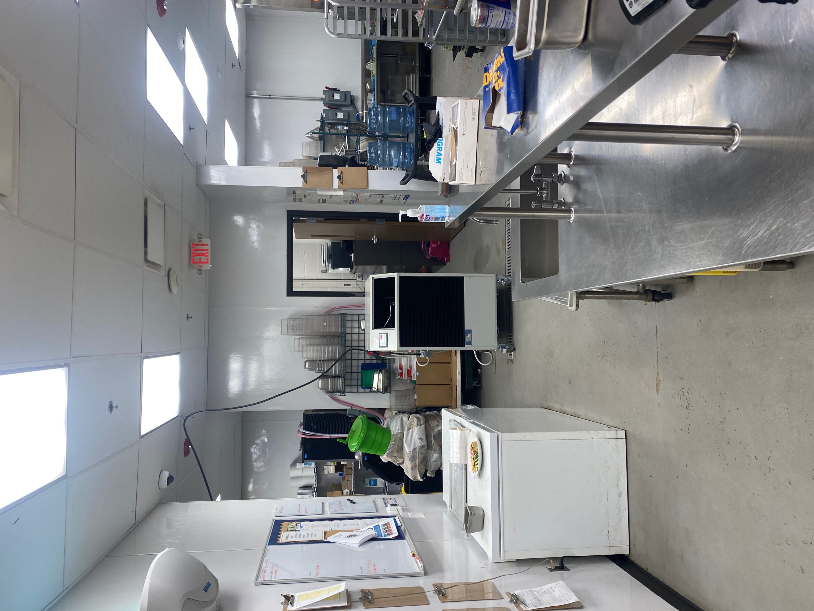 5-ton portable rental unit installed in restaurant kitchen with electrical cord routed across the drop ceiling tiles. 