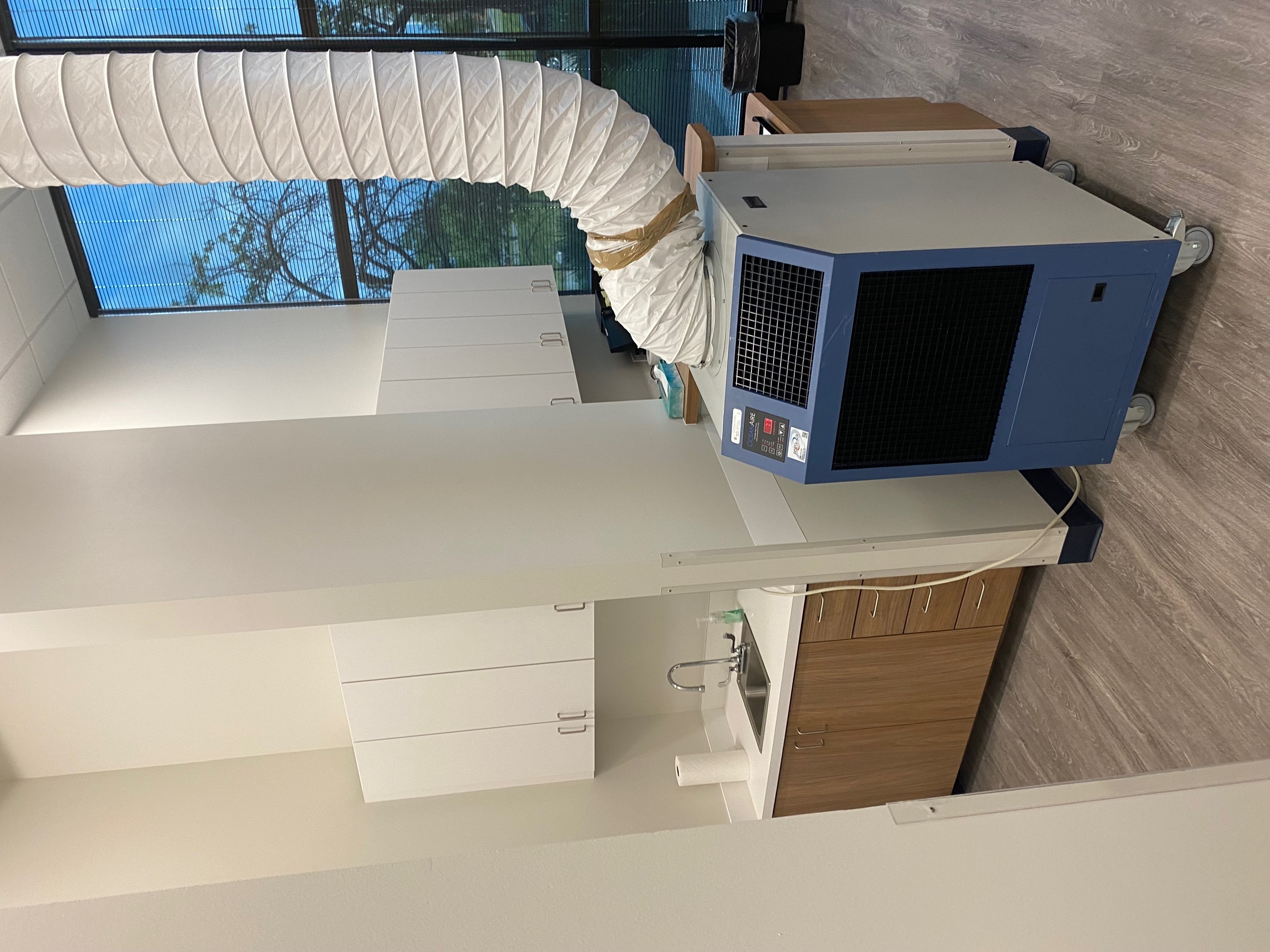 A metal portable HP rental unit, heating and cooling the office space. 