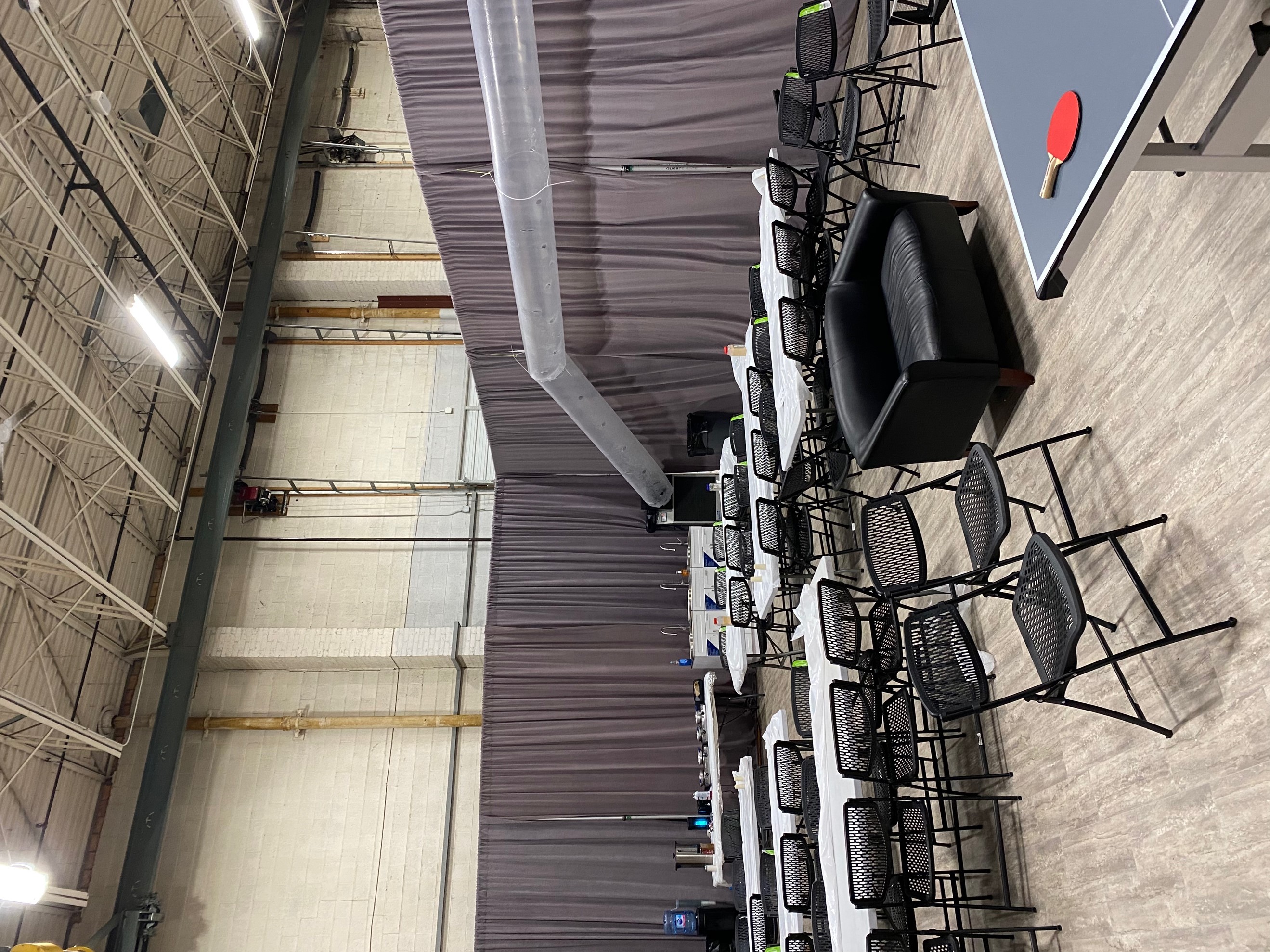Curtained off area in gymnasium for school classes with cool air being distributed evenly through lay flat ductwork from Air Conditioning Rental.  