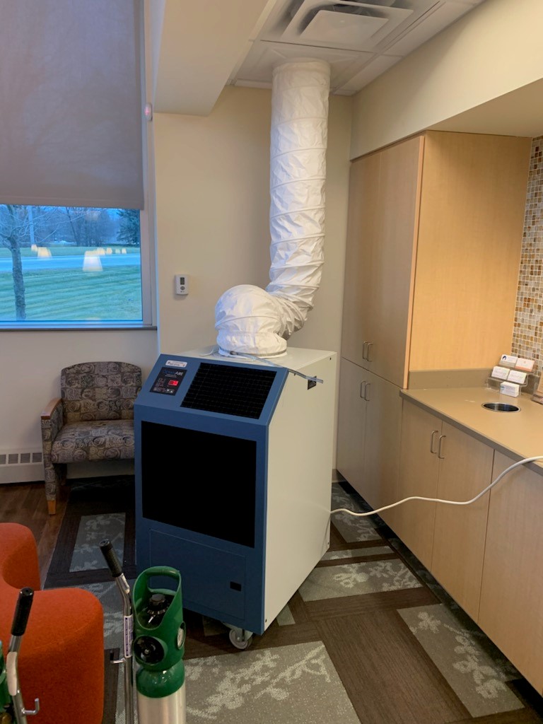 Heat Pump positioned in hospital waiting area for patients supplying supplemental heat to take the chill out of the air. 
