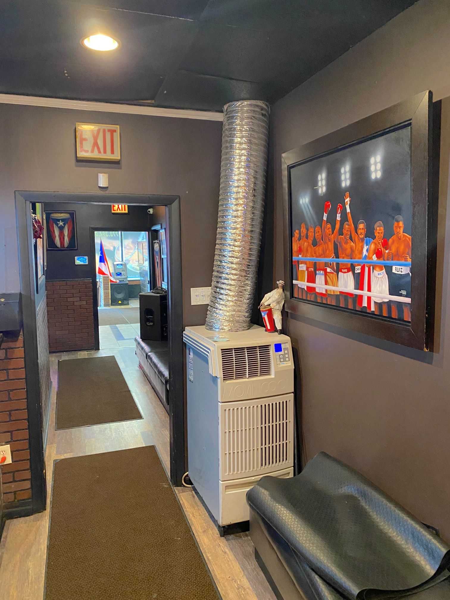 Portable AC in restaurant dining area providing additional cooling. 